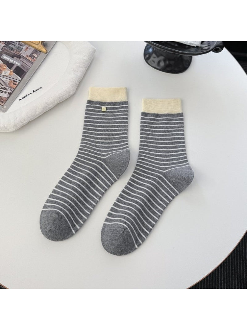 Dark gray striped crew socks with contrasting ivory cuffs