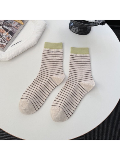 Beige striped crew socks with contrasting olive green cuffs