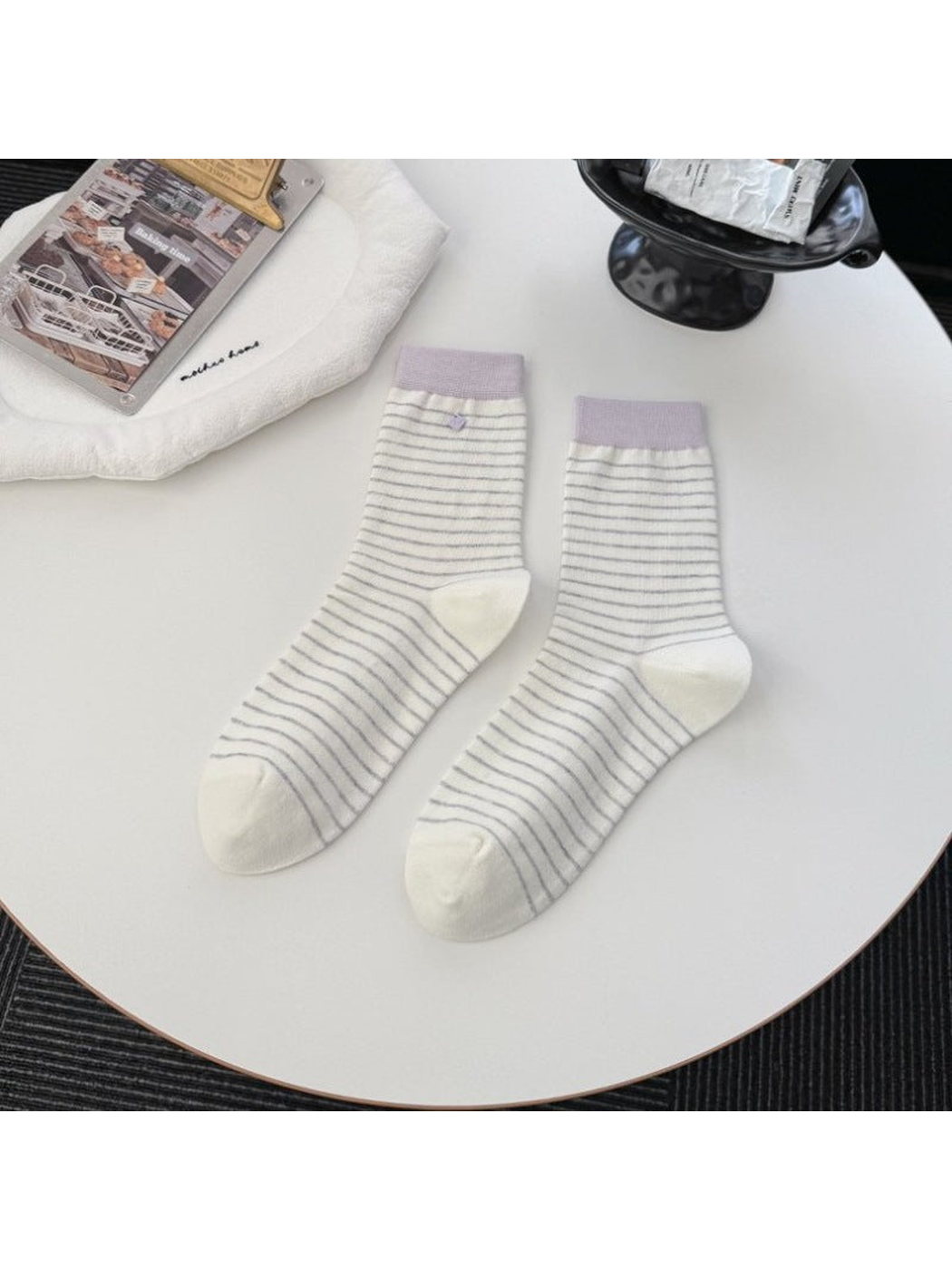 White striped crew socks with contrasting light purple cuffs