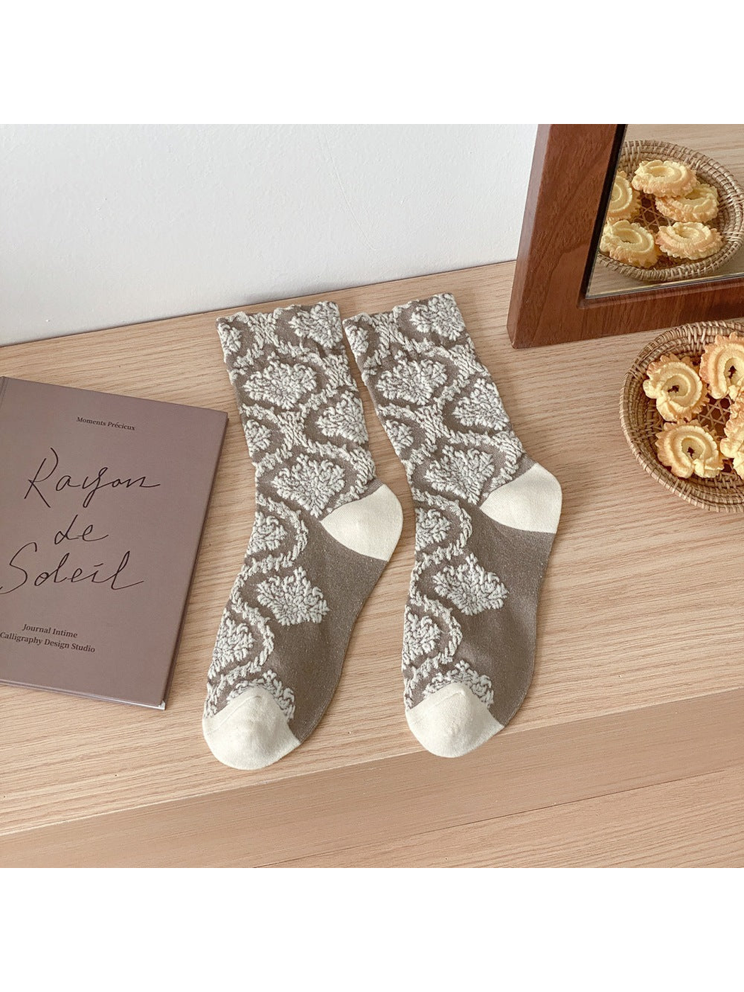 Greige patterned crew socks with contrasting ivory toes and heels