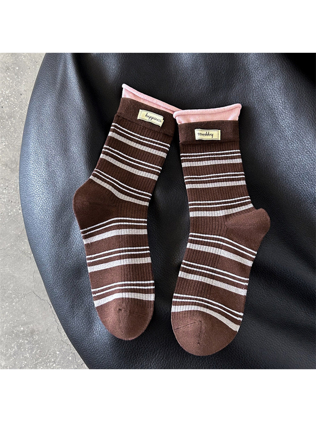 Brown crew socks with gray stripes and pink rolled cuffs