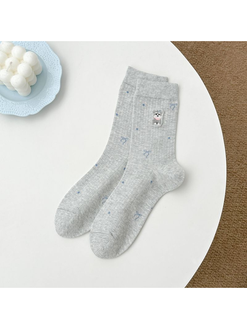 Light gray crew socks with embroidered animal, bow and dot motifs