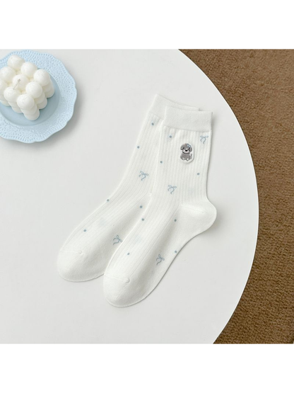 White crew socks with embroidered animal, bow and dot motifs