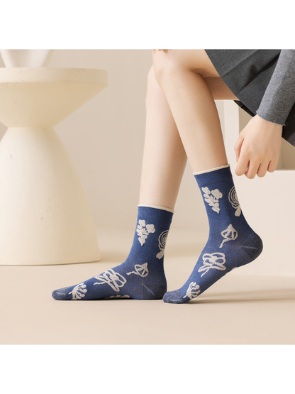 Blue botanical crew socks with contrast trim, side view