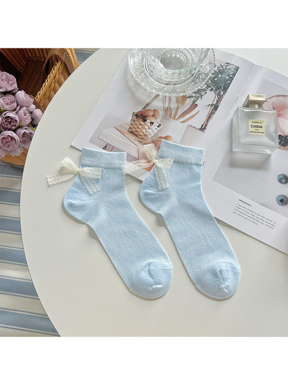 Light blue ankle socks with ivory lace bows