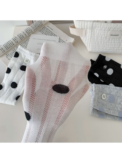 Close-up of the sheer vertical panels and contrasting polka dots
