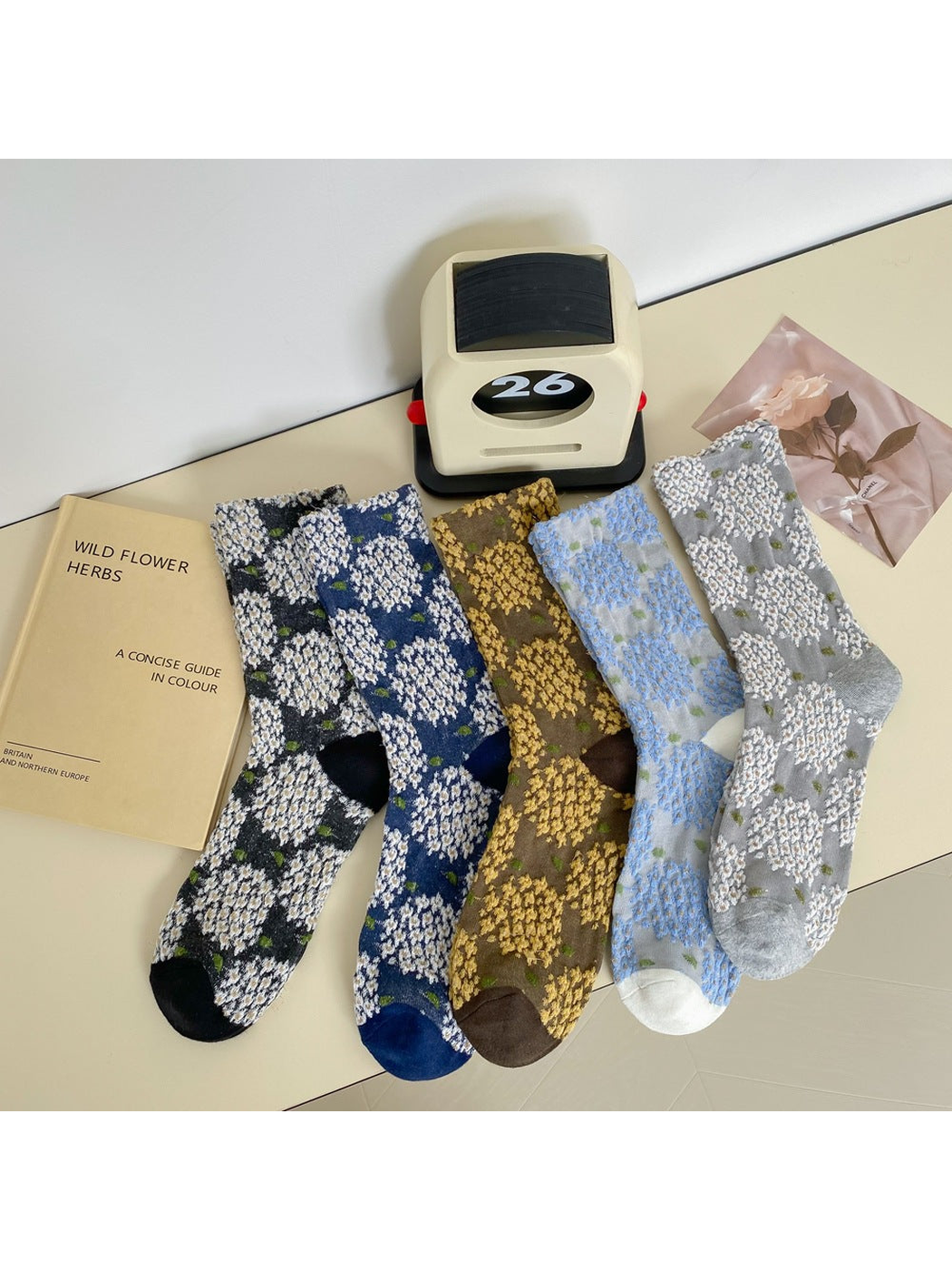 Five floral crew sock color variants displayed together