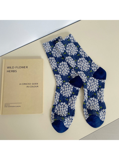 Navy crew socks with raised white floral clusters