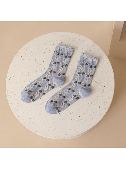 Pale blue-gray floral crew socks displayed as a pair