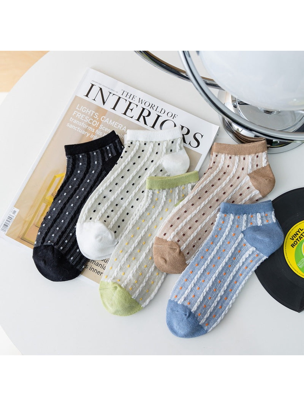 Five colors of sheer dotted ankle socks displayed together