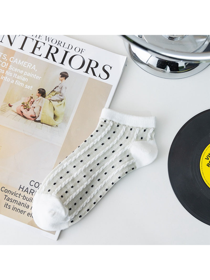 White sheer ankle sock with black dotted vertical stripes