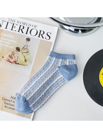 Light blue sheer ankle sock with orange dotted stripes