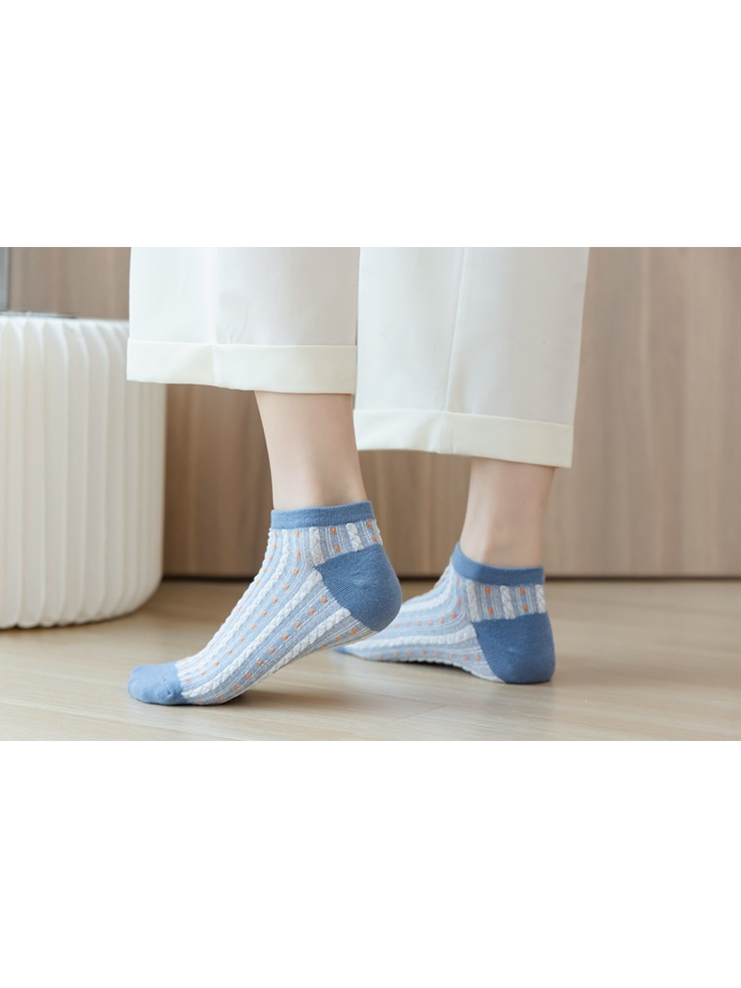 Light blue dotted ankle socks shown from the side while worn