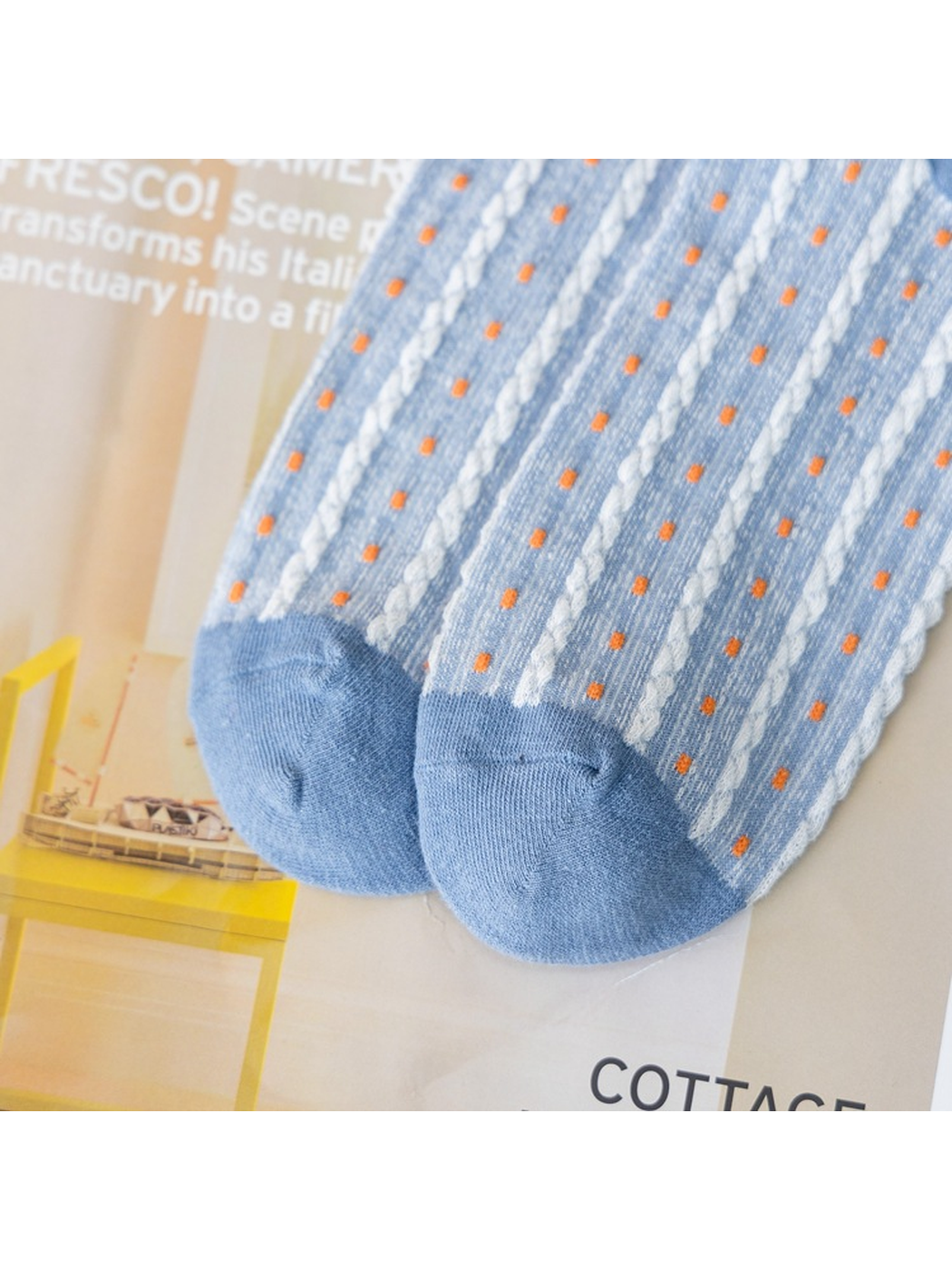 Close-up of the light blue sock toes and raised dotted stripe texture