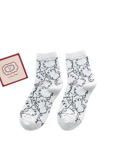 White crew socks with an allover cat outline pattern