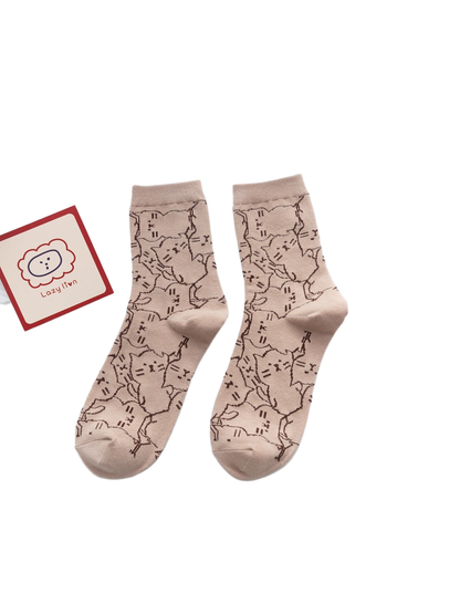 Light khaki crew socks with a dark cat outline pattern