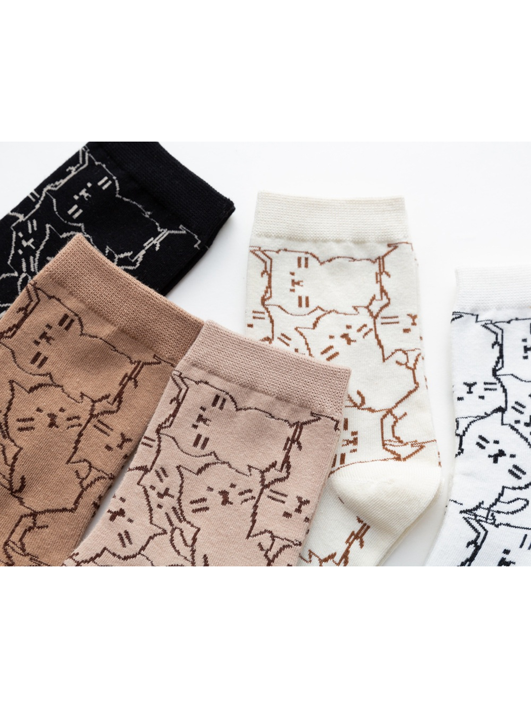 Close-up of the cat outline pattern across multiple sock colors