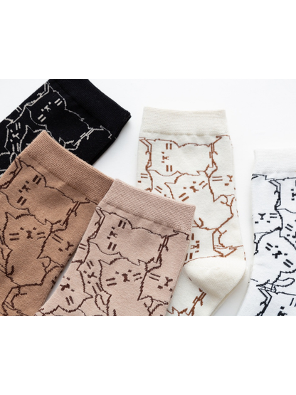 Close-up of the cat outline pattern across multiple sock colors