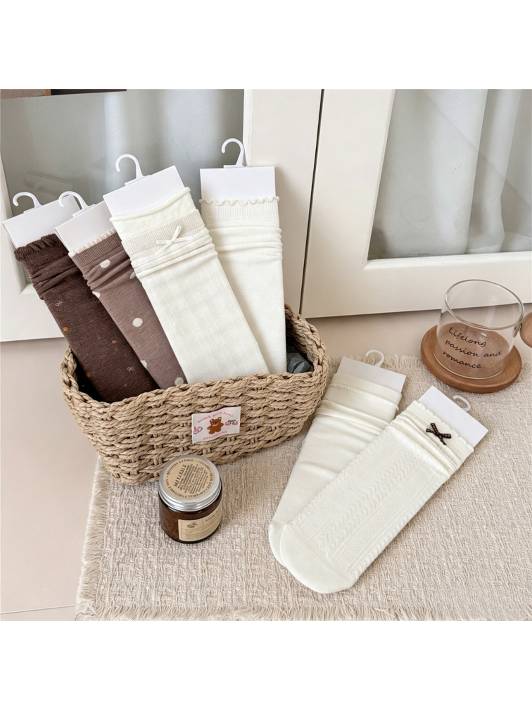 Six coordinating crew sock styles arranged in and beside a woven basket
