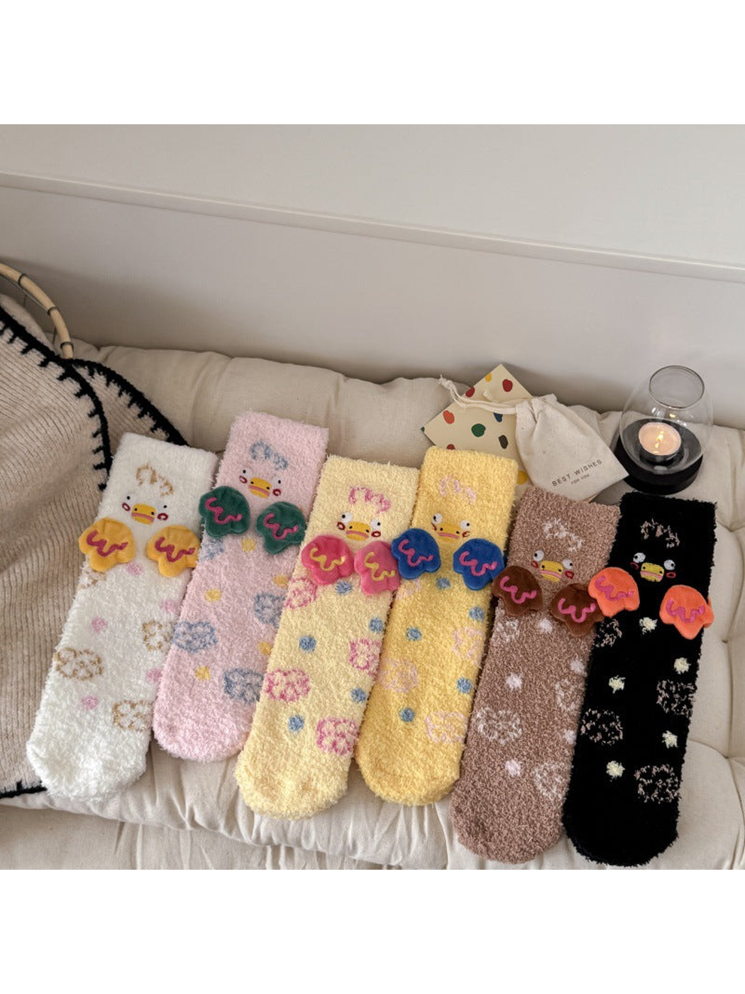 Six duck-motif fuzzy crew sock colorways displayed together