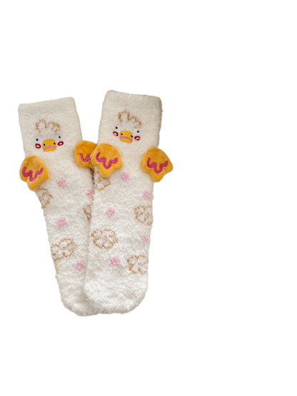 White duck-motif fuzzy crew socks with raised yellow wing appliqués