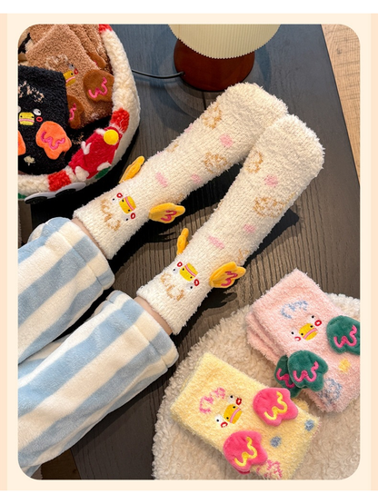 White duck-motif crew socks worn beside folded pink and yellow colorways