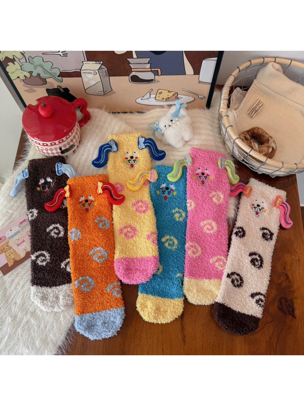 Six colorful fuzzy crew sock styles with cartoon faces and raised ear appliqués