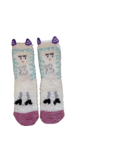 White fuzzy crew socks with purple horn appliqués and character design