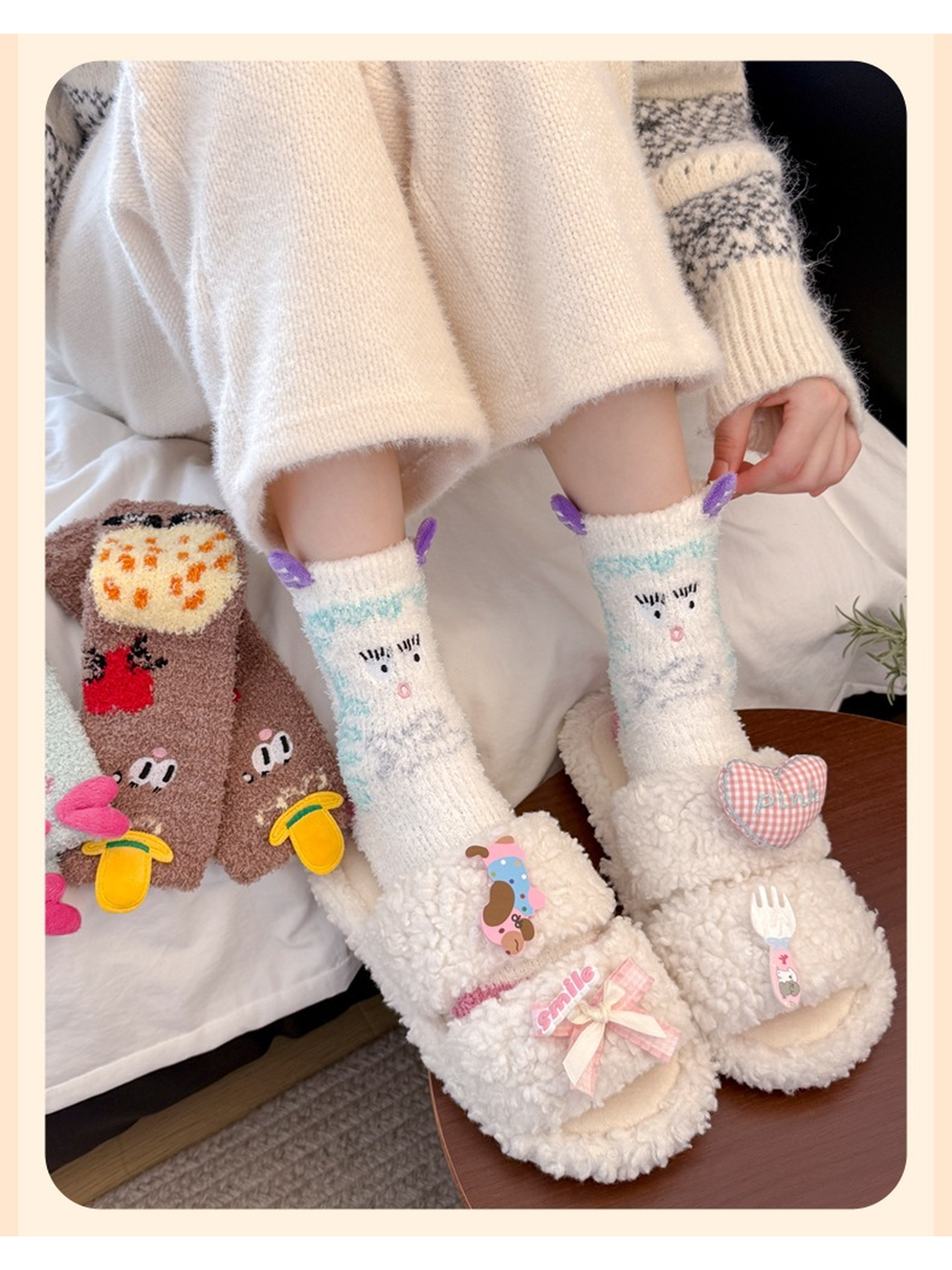 White character crew socks with purple appliqués worn with slippers
