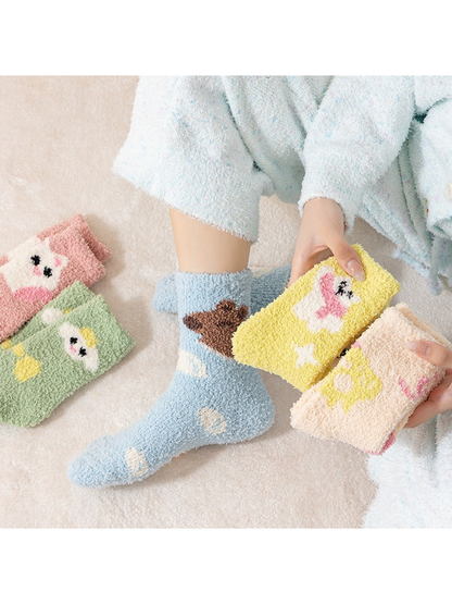 Assorted fuzzy crew socks displayed with one light blue pair worn