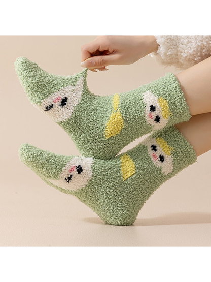 Green fuzzy crew socks worn and gently stretched at the toe