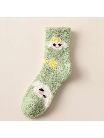 Green fuzzy crew sock with cartoon face motifs