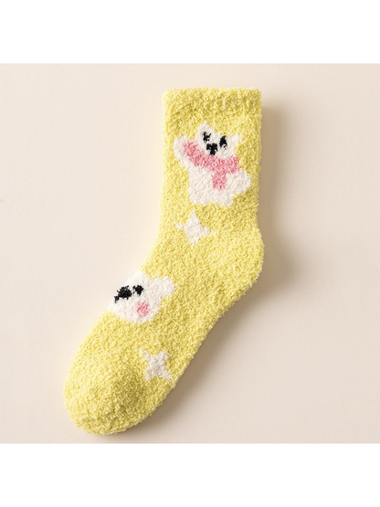 Yellow fuzzy crew sock with cartoon animal motifs