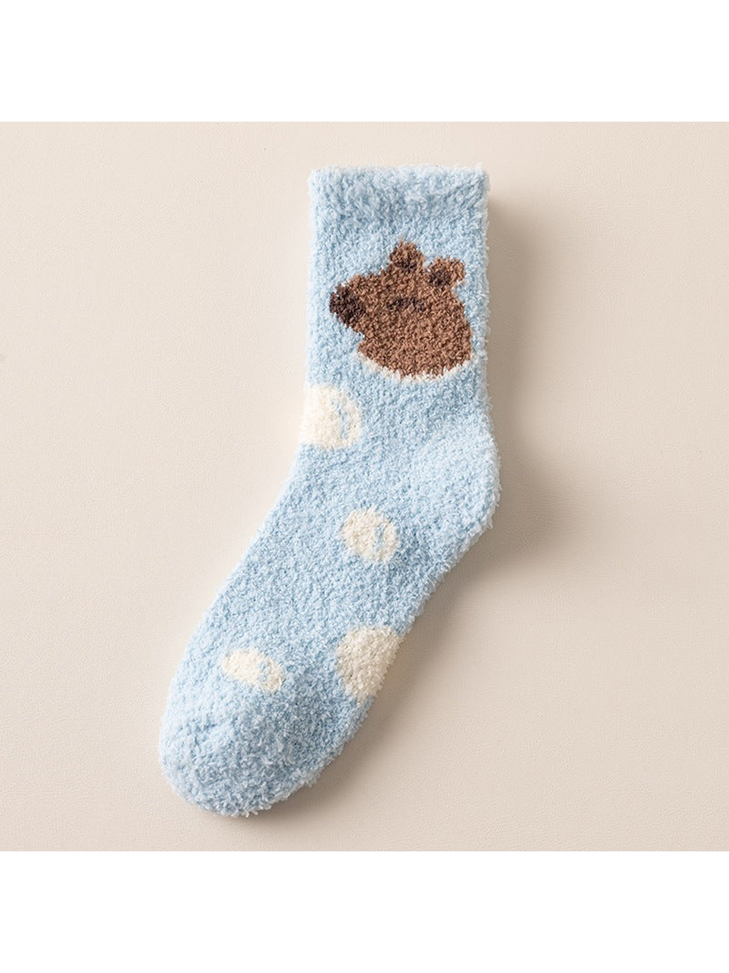 Light blue fuzzy crew sock with bear and spot motifs