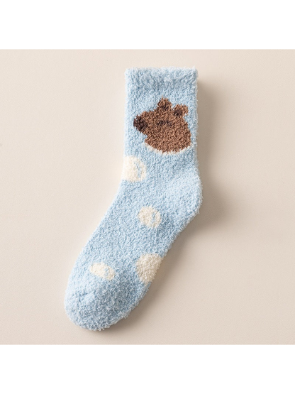 Light blue fuzzy crew sock with bear and spot motifs