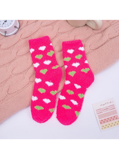 Fuchsia fuzzy crew socks with green and white heart motifs