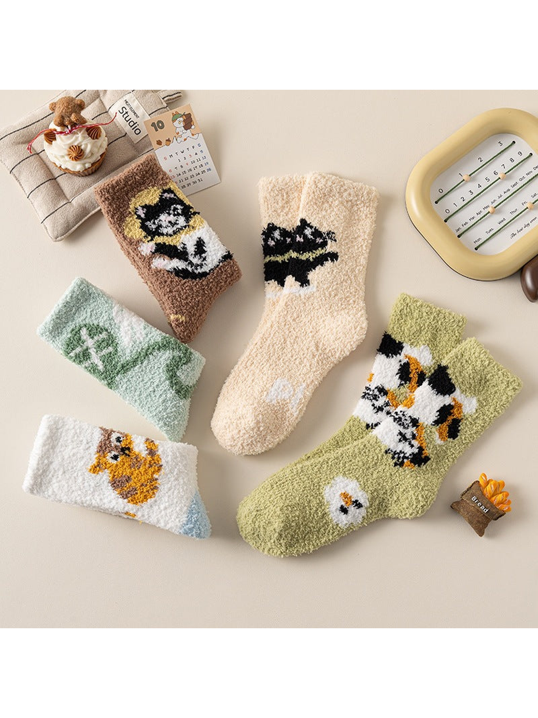 Five fuzzy crew sock designs arranged in a flat lay