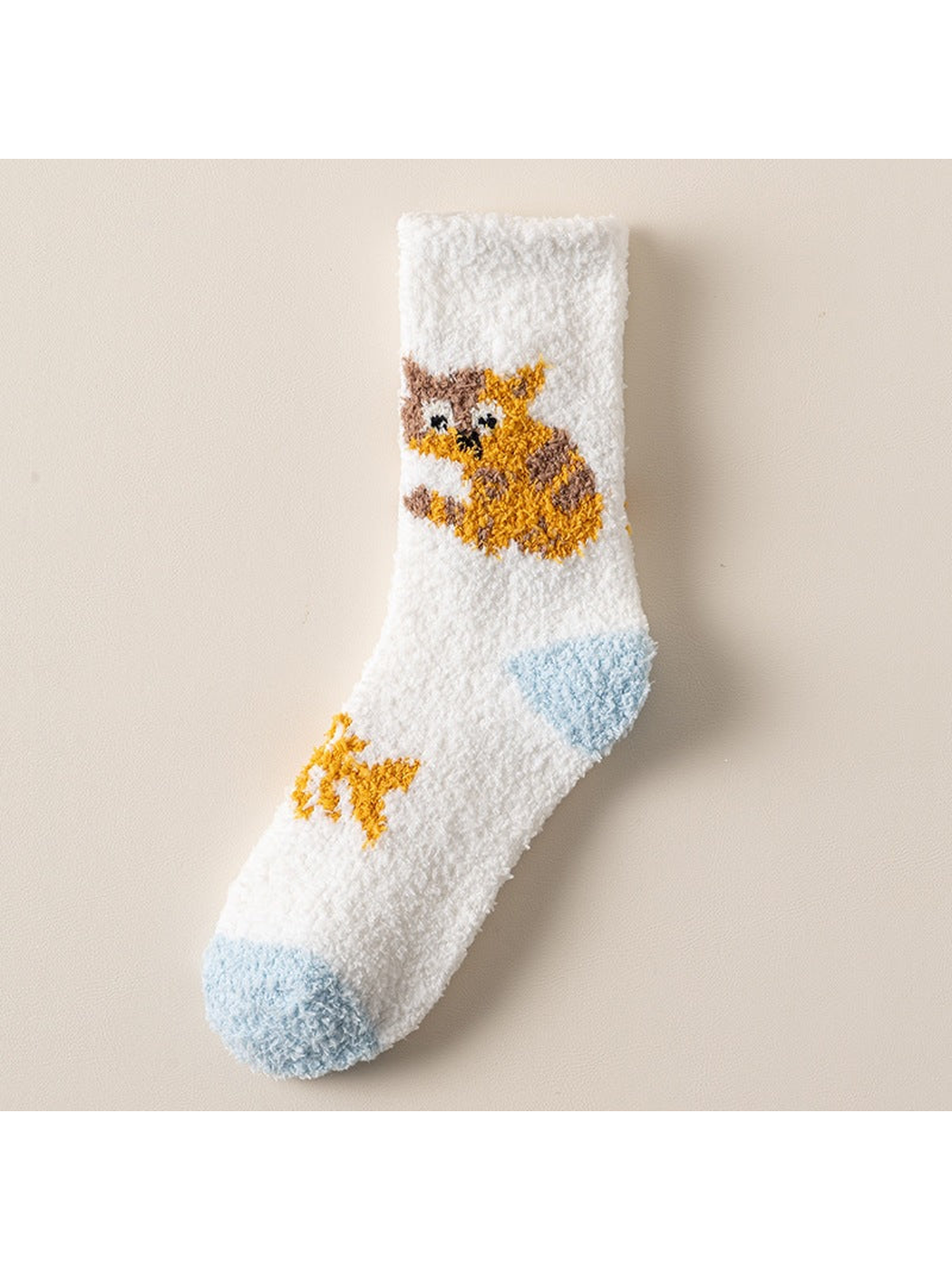 White crew sock with orange animal motif and light blue toe and heel