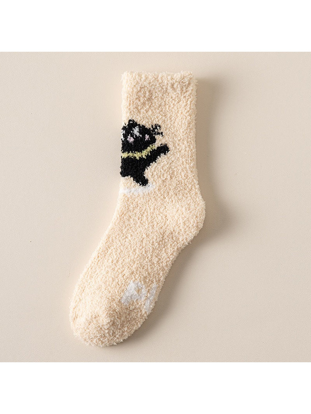 Cream crew sock with black animal motif and green accent