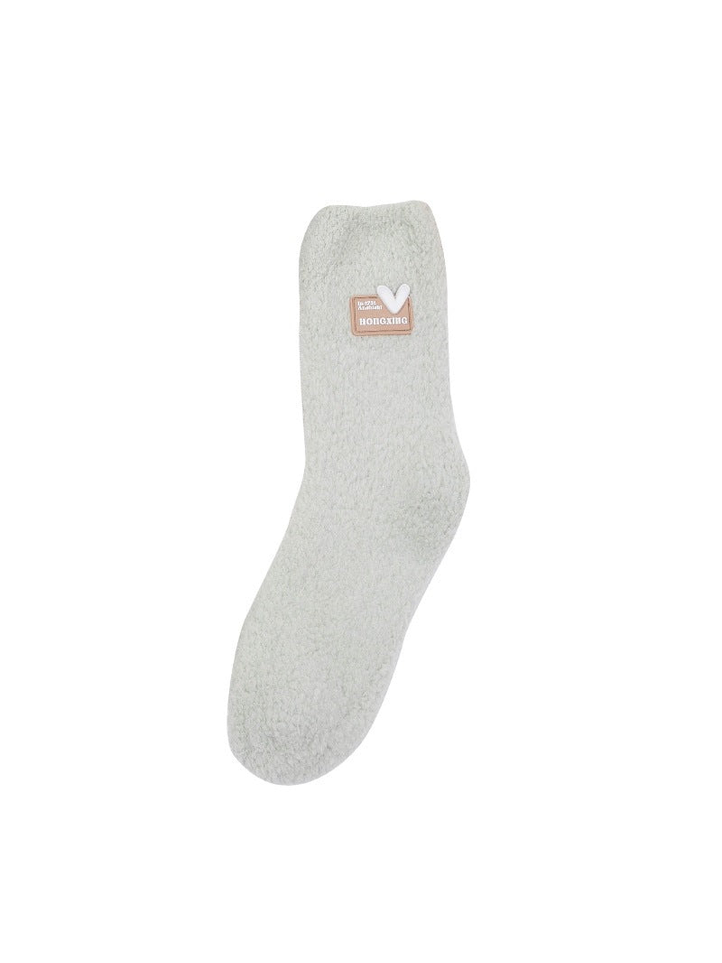 Solid fuzzy crew sock with a small cuff patch on a white background