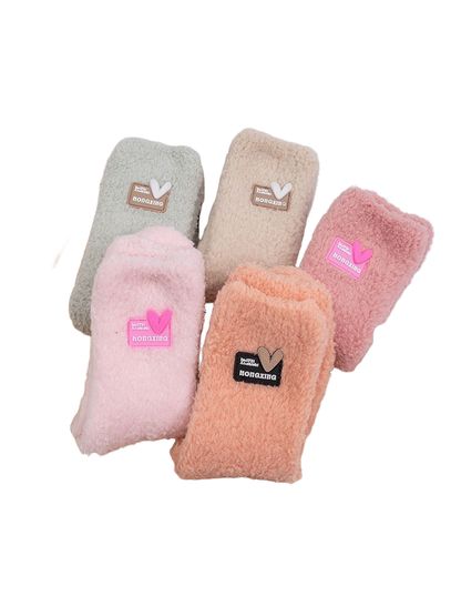 Solid-color fuzzy crew socks in five pastel shades