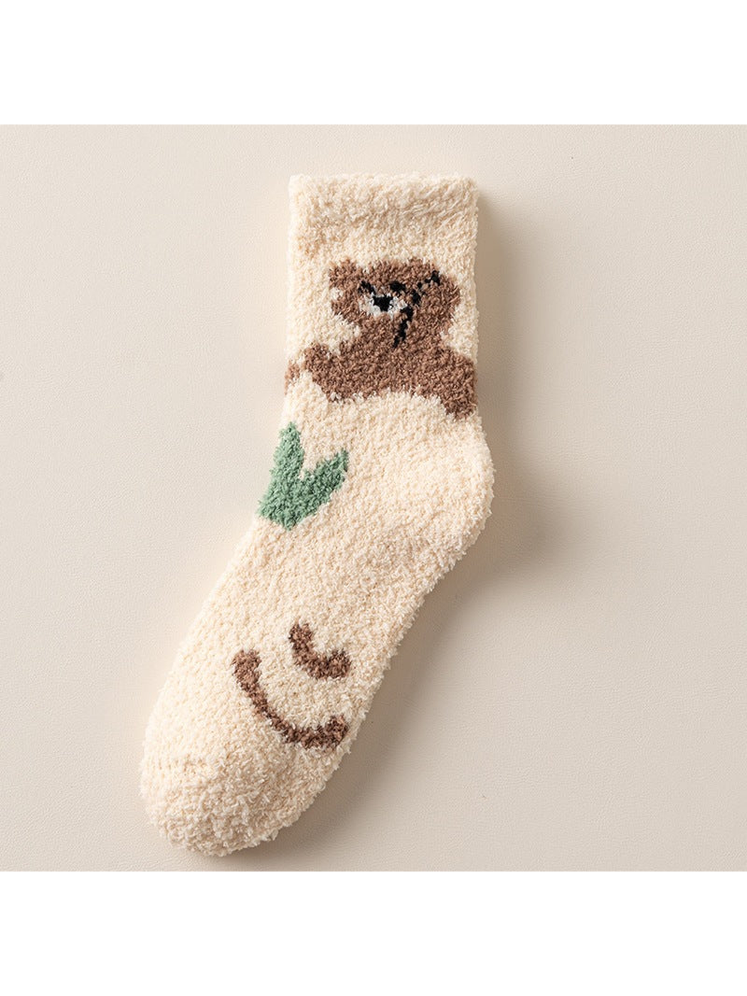 Ivory fuzzy crew sock with brown bear, green leaf and smiling face motifs