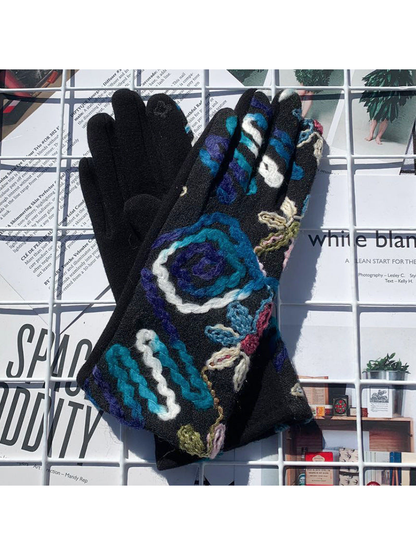 Blue floral gloves showing the plain palm and decorated back