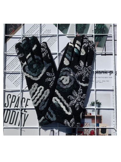 Black and gray floral gloves with raised decoration, back view