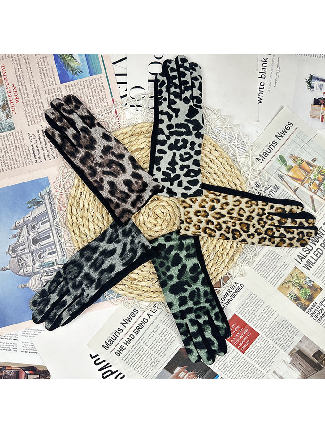 Five leopard-print glove colors arranged on a woven mat