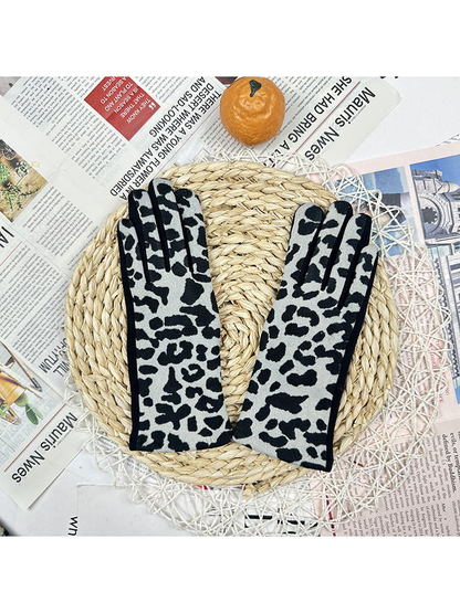 Light gray leopard-print gloves displayed as a pair