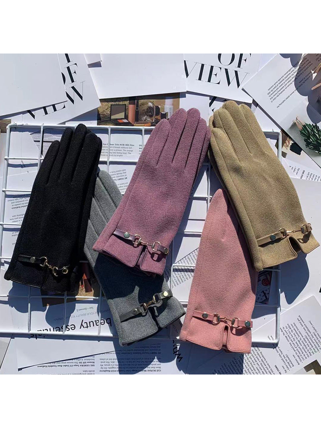 Gloves in multiple colors displayed together with decorative wrist accents