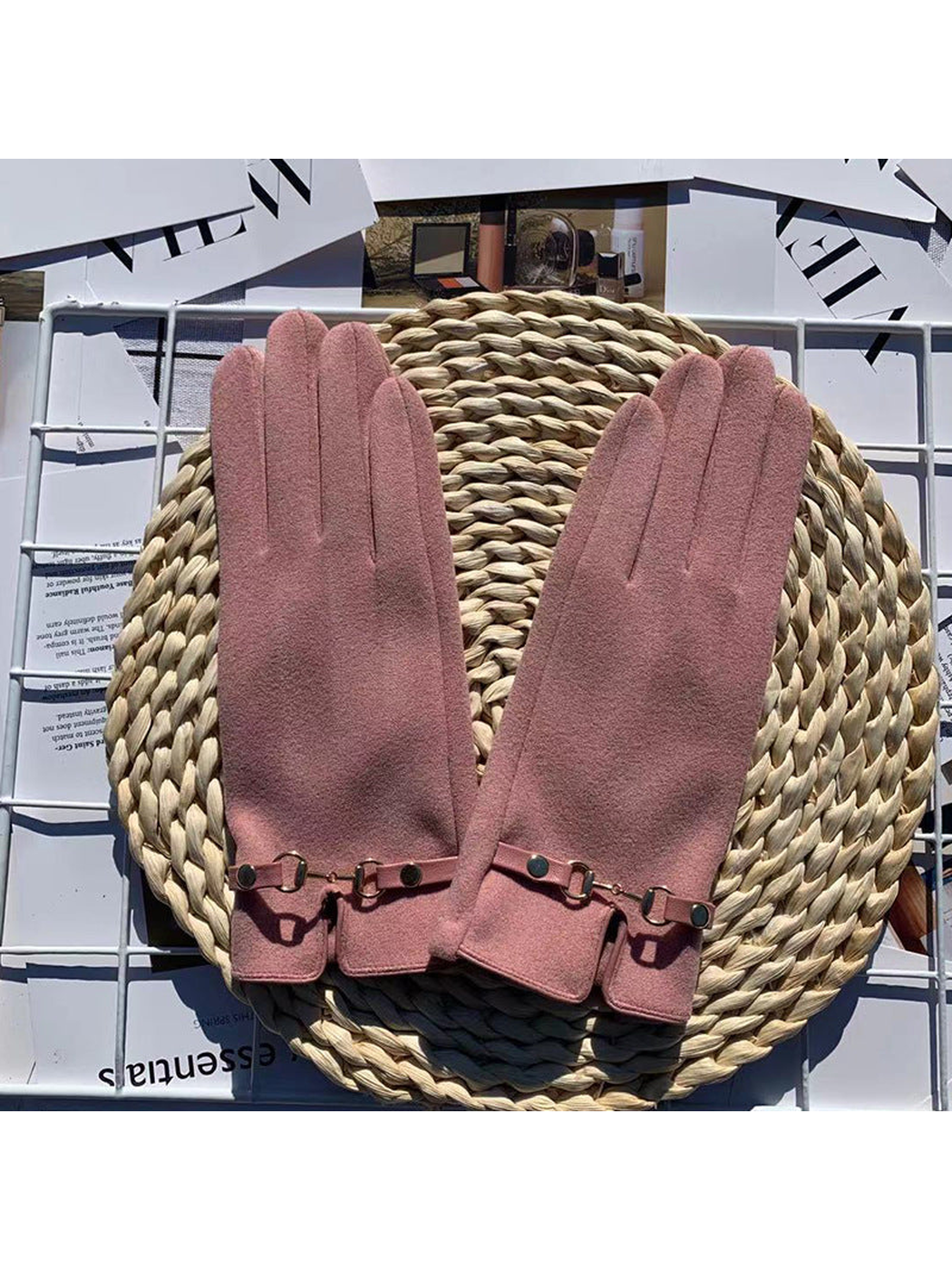 Pink five-finger gloves with decorative wrist straps