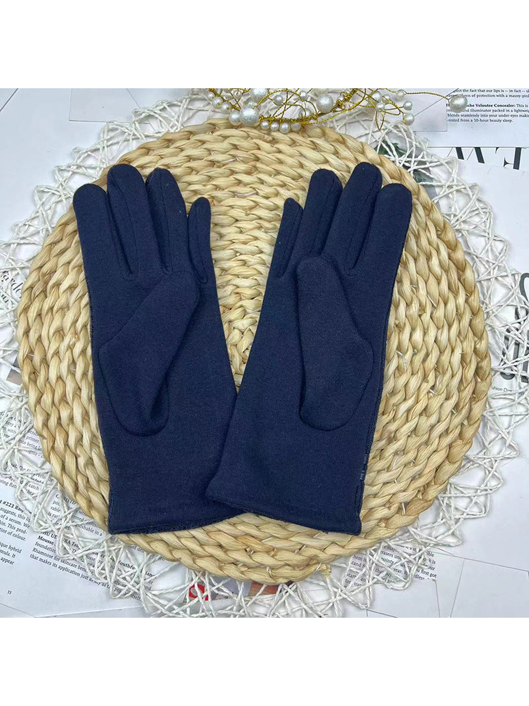 Reverse view of navy gloves showing curved palm panels