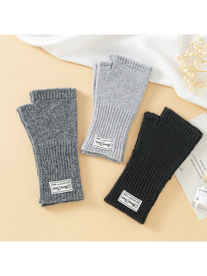 Black, dark gray and light gray fingerless gloves displayed together